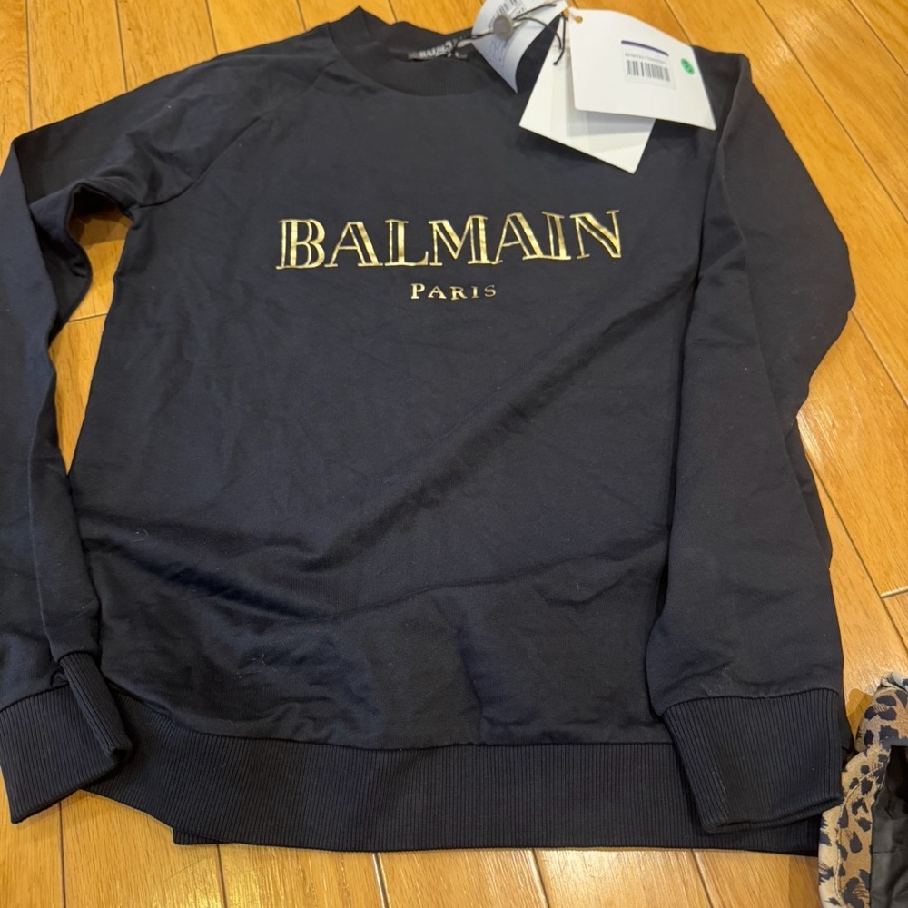 Balmain Paris women’s black Crewneck Sweater with Gold Logo